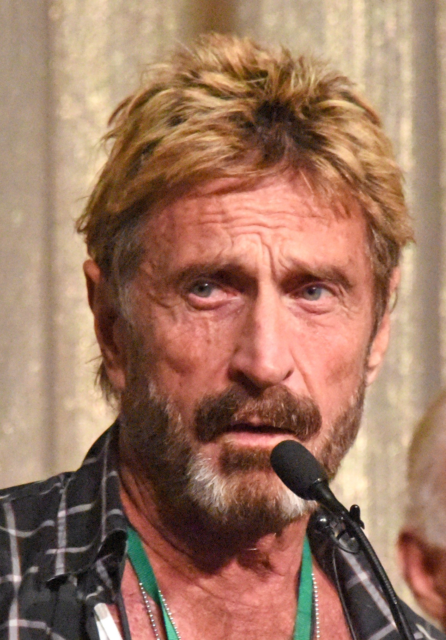 John McAfee não poderá visitar Blockchain World Conference por ameaças de assassinato